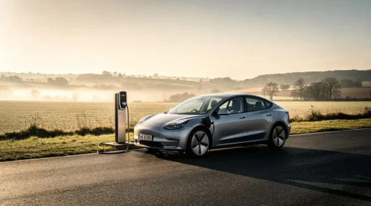 Electric car parked at a rural charging station at golden hour during a long-distance road trip